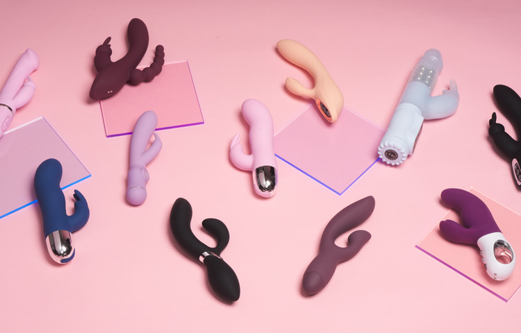 Eleven rabbit vibrators on a pink background