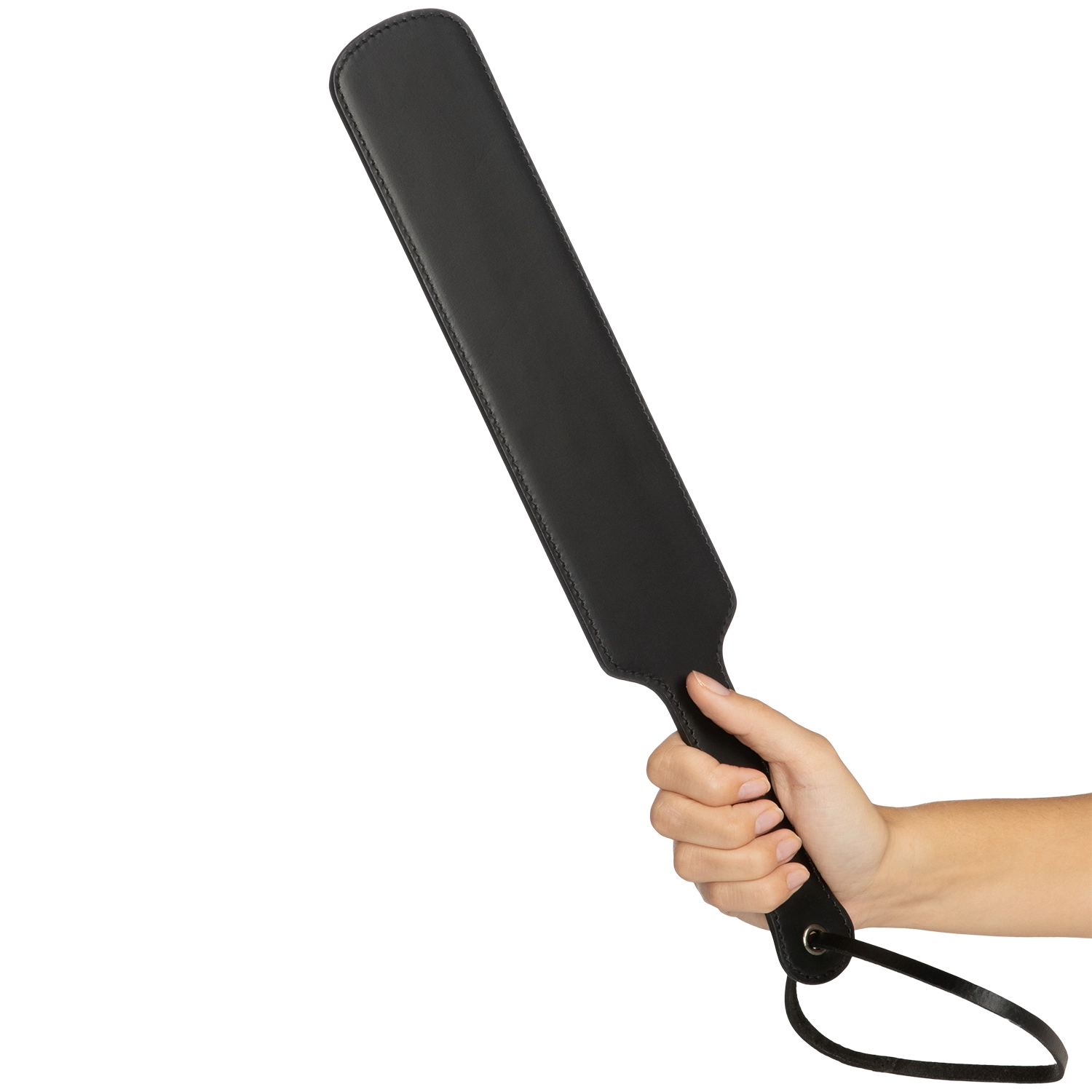 A hand holding a leather paddle