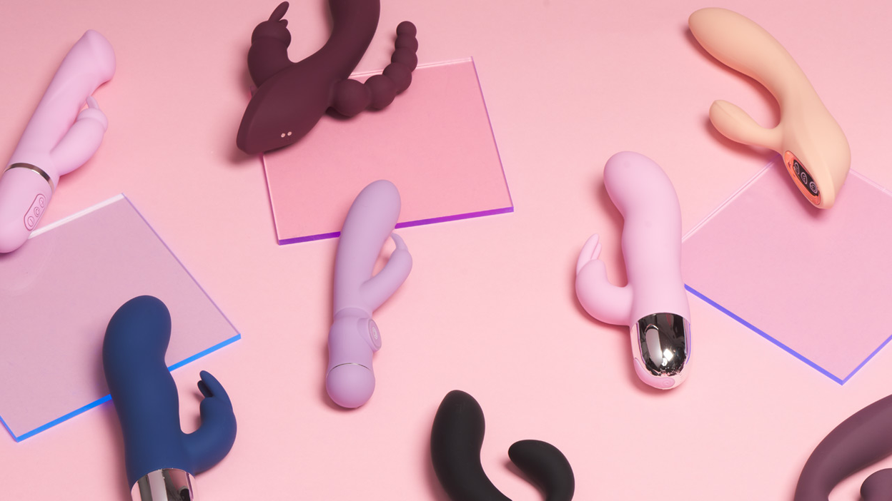 A lot of different rabbit vibrators on a pink background