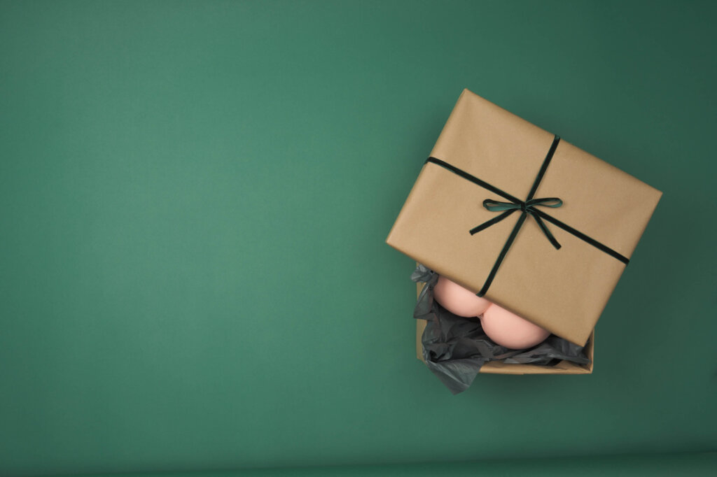 Green background with a open present on