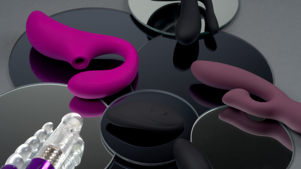close up of different sex toys on mirrors