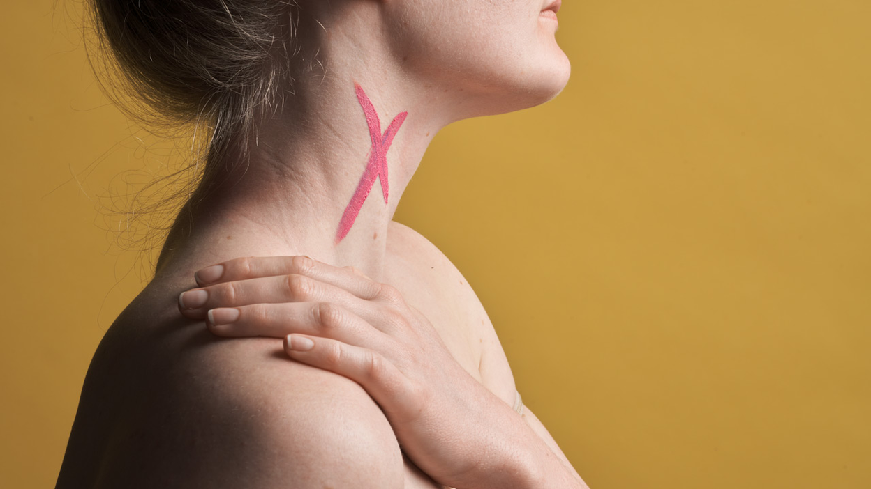 Red cross on the throat of a woman