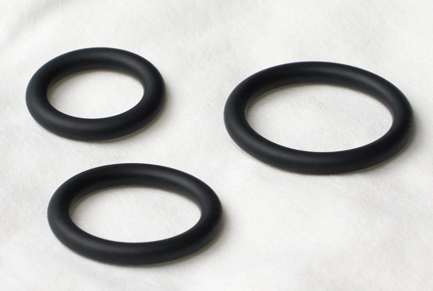 Three penis rings in different sizes.