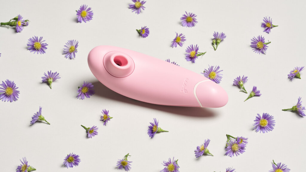 Ein Klitoris-Stimulator und viele kleine Blumen