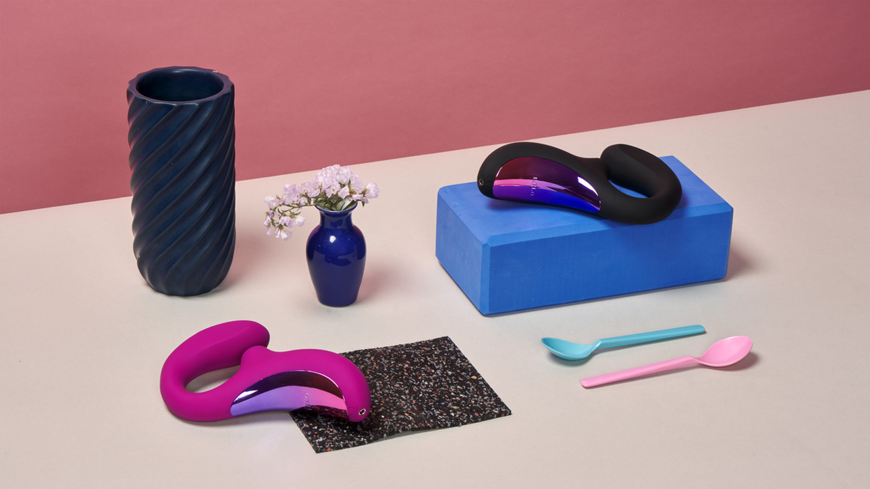 LELO Enigma and various decorative items on a table