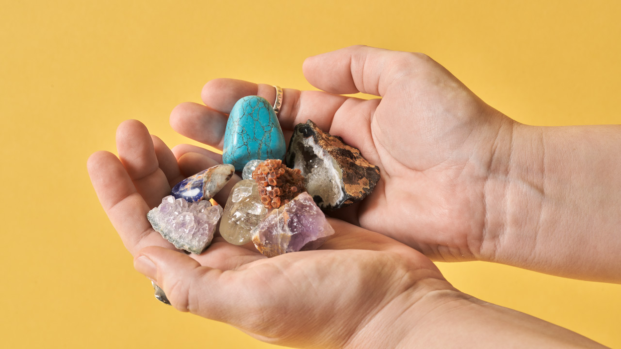 Stones and crystals in a pair of hands