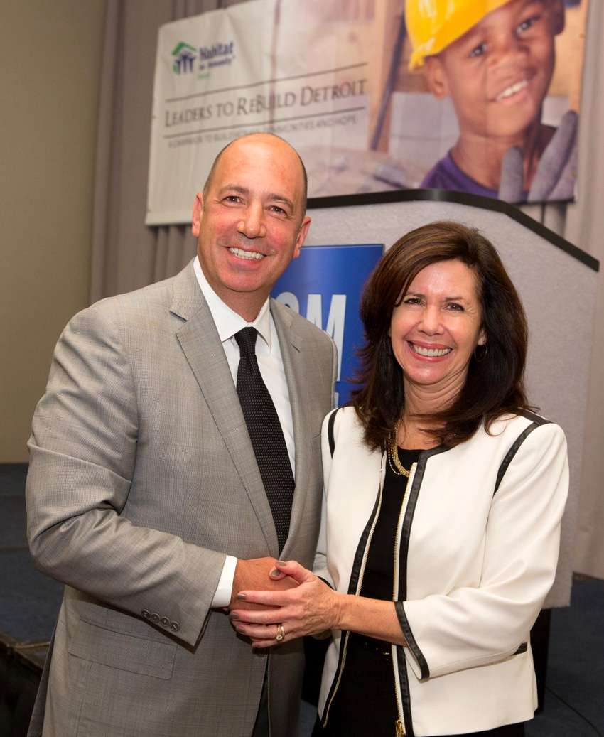 GM purchasing chief Grace Lieblein with Lear CEO Matt Simoncini one supplier partner on Habitat for Humanity donation