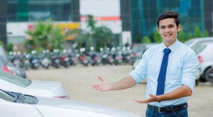 happy car dealership employee