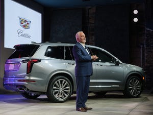 Brand chief Carlisle with Cadillac XT6 in Detroit.