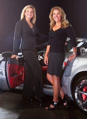 Sisters Courtney Cole left and Monica Peck coown dealership