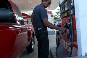 Falling gasoline prices pressure automakers trying to develop fuelefficient vehicles to meet government standards