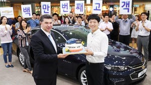 GM Korea President Kaher Kazem with feted buyer of companyrsquos 1 millionth vehicle a Chevrolet Malibu in September 2017