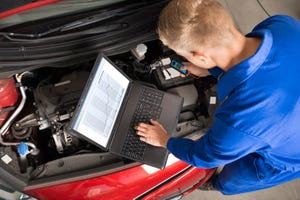 auto mechanic with computer
