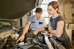 auto tech with young customer