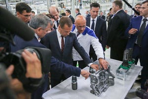Russian Prime Minister Medvedev inspects cylinder block made at VW Kaluga plant