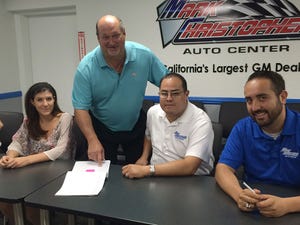 Leggio standing at sales meeting with staffers from left Ashley Gordon Nevin Cordero and Joe Gonzalez