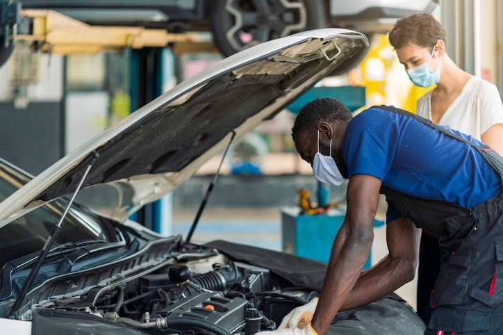 Dealer - mechanic with customer Dealer - mechanic with customer