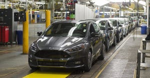 line-of-black-cars-manufacturing