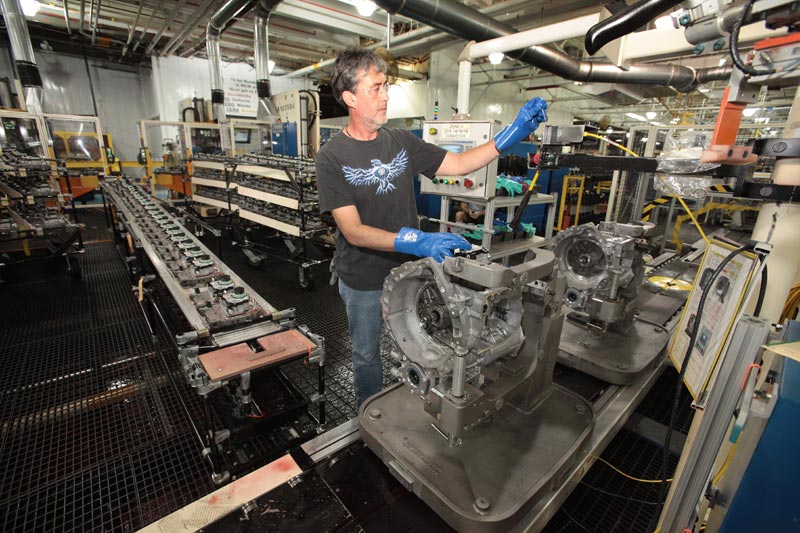 Chrysler worker at Kokomo IN plant assembles valve bodies