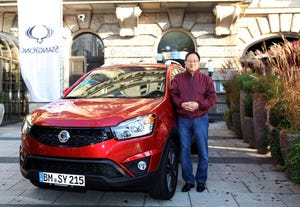 Ssangyong President and CEO Lee poses with restyled Korando C which accounted for onethird of automakerrsquos 2013 sales in five months on market
