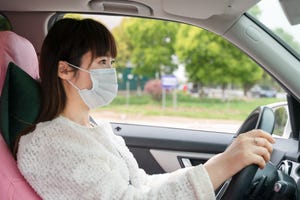 Masked Asian woman driver (Getty)