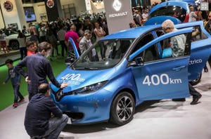 Visitors to Barcelona auto show examine Renault Zoe 40 electric vehicle