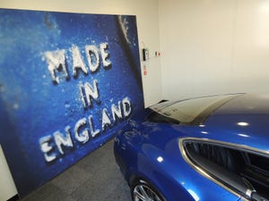 Continental GT coupe parked at Crewe plant entrance celebrates British heritage