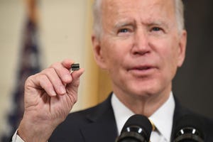 Biden with microchip (Getty)