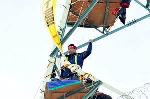 Choi Byungseung waves from electrical tower where he spent 10 months