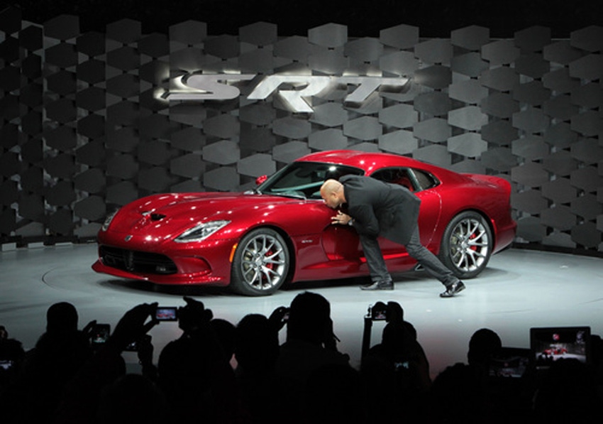 SRT brand chief Ralph Gilles kisses new Viper at New York auto show