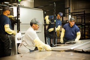 Technicians inspect metal stampings at Nissanrsquos Canton MS plant