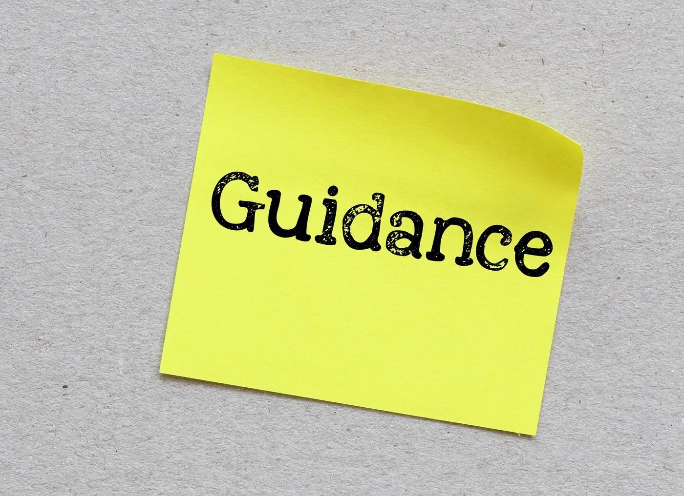 The word GUIDANCE on a small piece of paper. The word GUIDANCE on a small piece of paper.