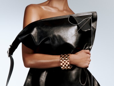 Abstract image of a floating trainer shoe. A bird is perched on the laces of the shoe.