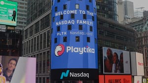 A photograph of the Playtia logo on a huge outdoor screen when the company went public on NASDAQ A photograph of the Playtia logo on a huge outdoor screen when the company went public on NASDAQ