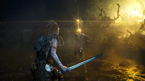 A screenshot from Senua. Senua holds a blade and faces off against a horrific monster. A screenshot from Senua. Senua holds a blade and faces off against a horrific monster.