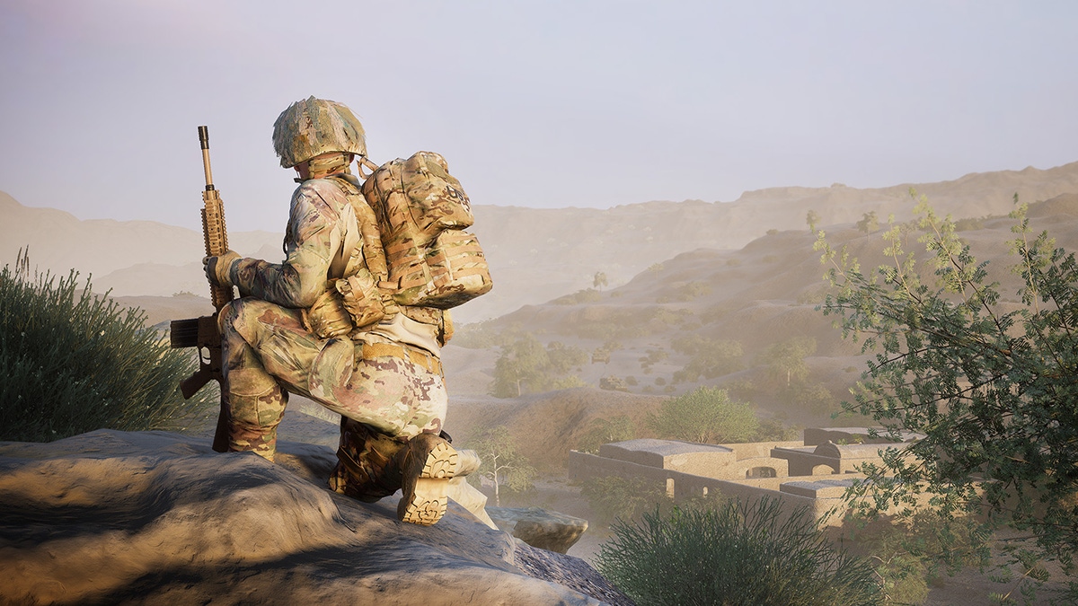 A screenshot from Squad depicting a lone soldier perched on a dusty hilltop A screenshot from Squad depicting a lone soldier perched on a dusty hilltop