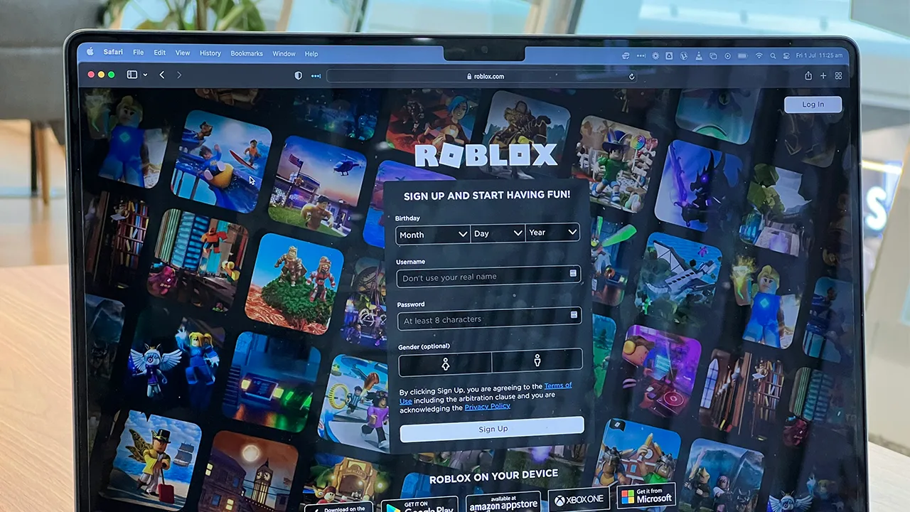 An off-screen photograph of the Roblox login age on a laptop An off-screen photograph of the Roblox login age on a laptop