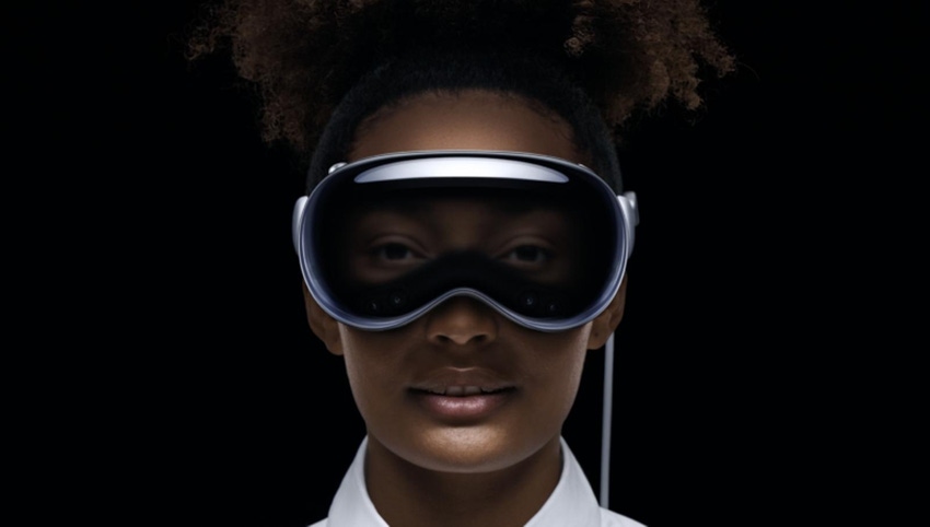 Promo image of a woman using the Apple Vision Pro mixed reality headset.