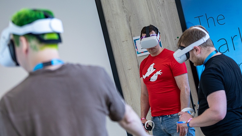 Three nDreams employees use VR headsets. Three nDreams employees use VR headsets.