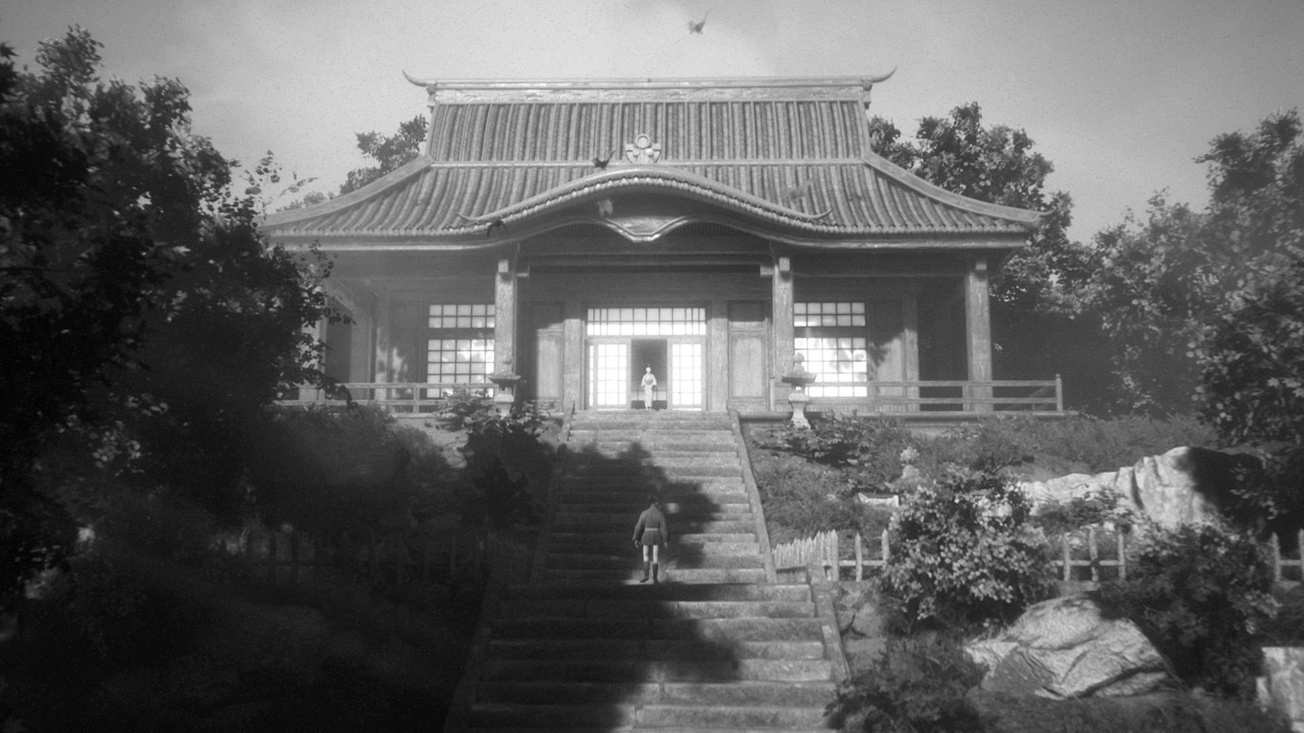 A screenshot from Trek to Yomi shows stairs leading to a photorealistic japanese building atop a forested hill.
