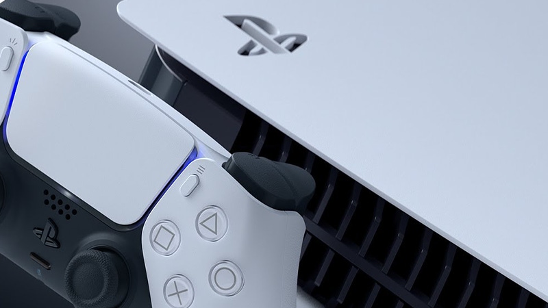 A photograph of the DualSense controller and PlayStation 5 console