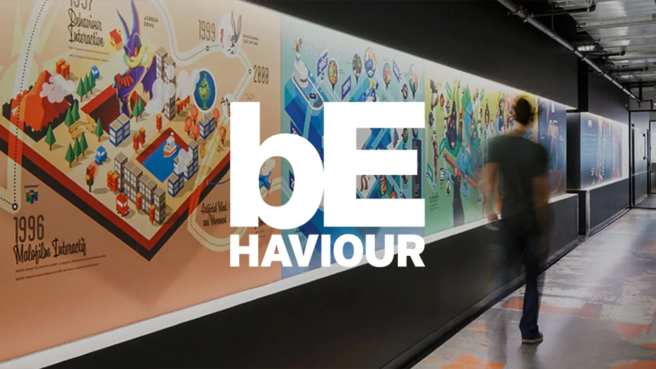 The Behaviour Interactive logo overlaid on a photograph of a company office The Behaviour Interactive logo overlaid on a photograph of a company office