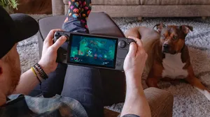 The Steam Deck running Dead Cells in the hands of a player The Steam Deck running Dead Cells in the hands of a player