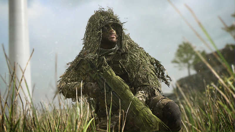 Screenshot of a soldier in a ghillie suit in Call of Duty: Modern Warfare II.
