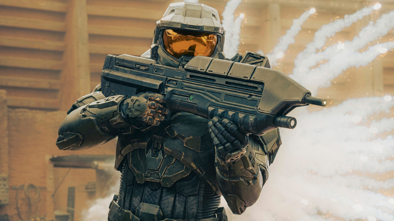 Master Chief from Halo: The Series wields his gun in front of an explosion. Master Chief from Halo: The Series wields his gun in front of an explosion.