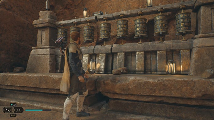 Jedi: Survivor protagonist Cal Kestis stands in front of a shrine with spinning ornaments.