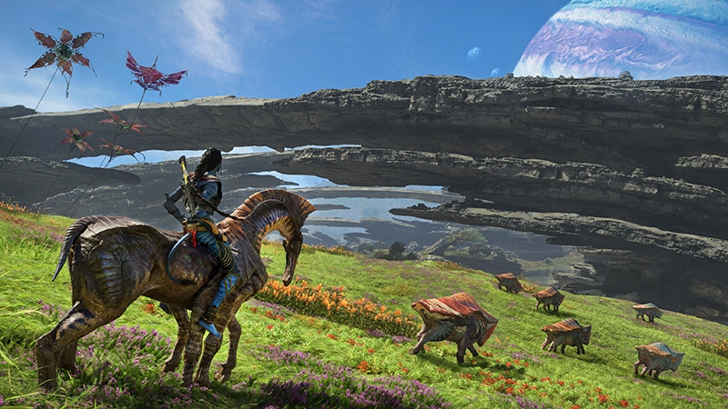 A screenshot from Avatar: Frontiers of Pandora. A Na'vi rides a horse-like creature over a grassy sci-fi plain. A screenshot from Avatar: Frontiers of Pandora. A Na'vi rides a horse-like creature over a grassy sci-fi plain.