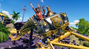 A screenshot of Planet Coaster 2 showing a group of people with their hands up in the air on a rollercoaster A screenshot of Planet Coaster 2 showing a group of people with their hands up in the air on a rollercoaster