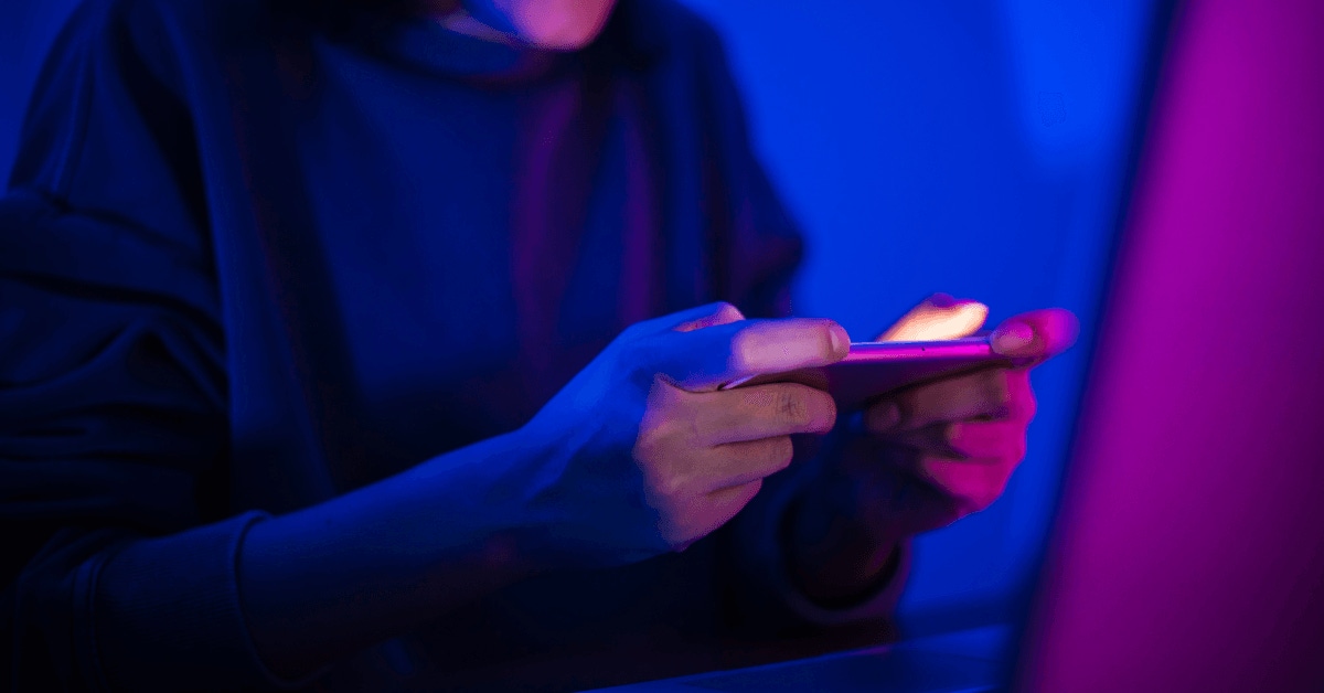 Screenshot of a young adult playing a video game on their mobile phone. Screenshot of a young adult playing a video game on their mobile phone.