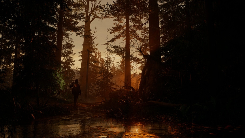 A screenshot from Alan Wake II showing an FBI agent entering a dark forest